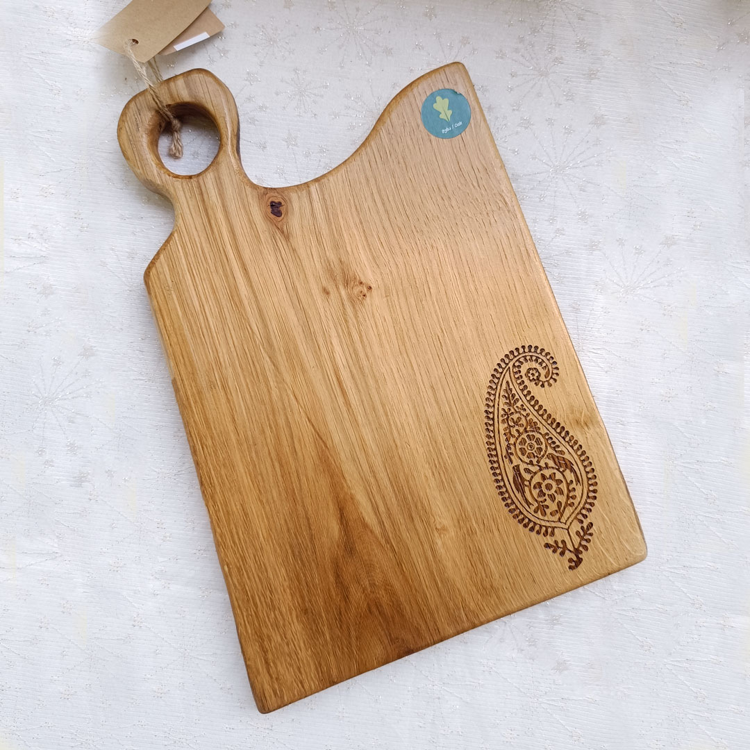 Cutting and serving board with ornament